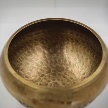 Tibetan brass singing bowl with Sanskrit – handmade meditation instrument for stress relief.