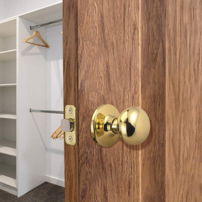 Design House Cambridge 2-Way Latch Passage Door Knob Polished Brass