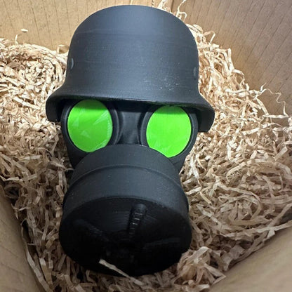 3D - printed trailer hitch cover with steel helmet and gas mask design. Protects the receiver tube from rusting.