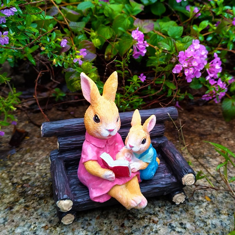 Simulated rabbit reading animal ornament