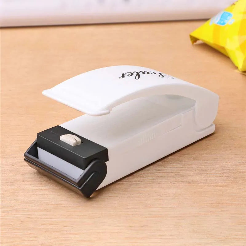 Mini sealing machine small household plastic sealing machine snack moisture-proof sealing machine