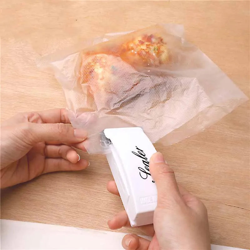 Mini sealing machine small household plastic sealing machine snack moisture-proof sealing machine