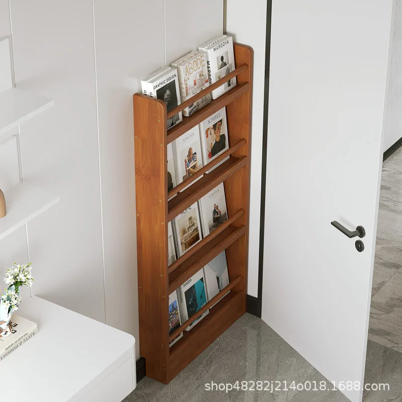 Behind the door, there is a small bookshelf, a multi-layer solid wood ultra-thin bookcase, a newspaper rack, a narrow slit child