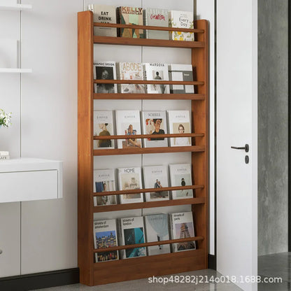 Behind the door, there is a small bookshelf, a multi-layer solid wood ultra-thin bookcase, a newspaper rack, a narrow slit child