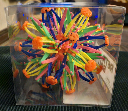 Open Box. ToyPlanet Retract-O Ball Collapsible Multi-Color Plastic Fidget Toy